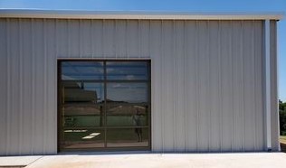 Modern glass garage door installation